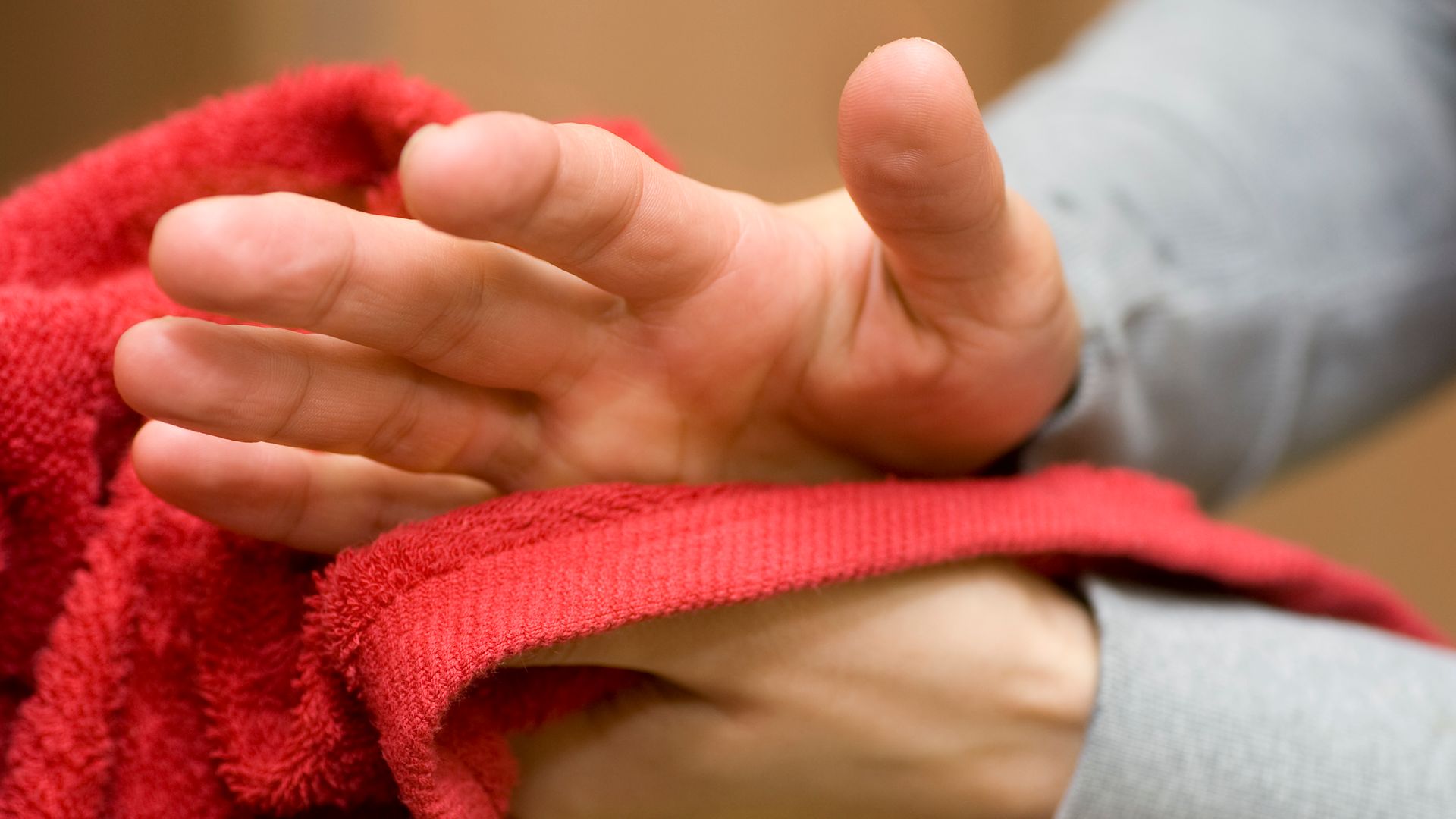 Man dries his hands with towel